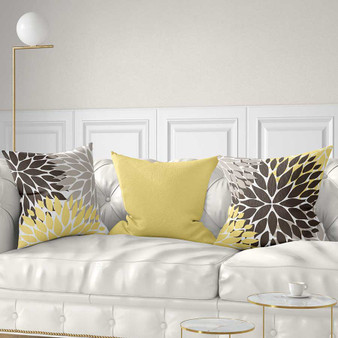 yellow, brown and gray floral throw pillows by Julia Bars