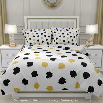 duvet cover and pillow shams with large black and golden yellow polka dots