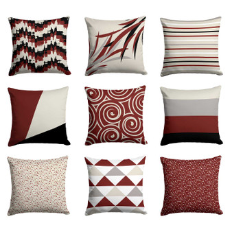 red, gray, black and beige throw pillows with geometric patterns