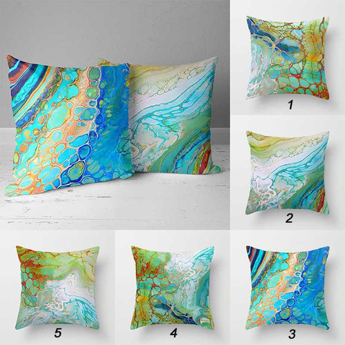 abstract pillows with organic shapes in blue, turquoise and golden brown