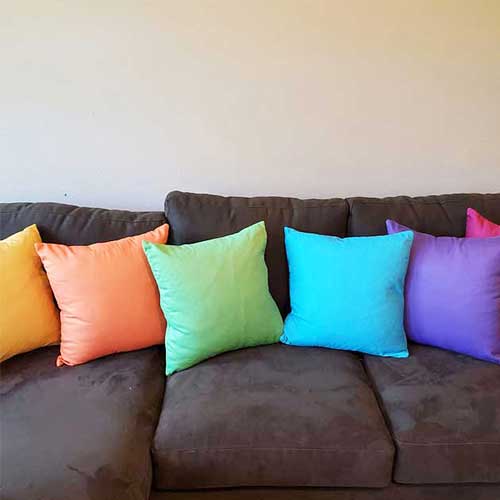 colorful accent pillows, green, blue, orange, purple