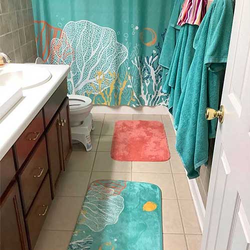 coral reef and fish shower curtain in teal, yellow and coral red