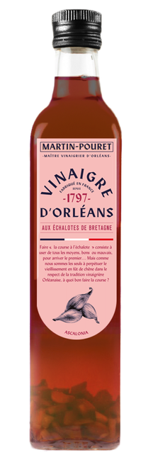 A 50 centiliter clear glass bottle of Martin-Pouret Orléans red wine vinegar with shallots, showcasing shallot pieces at the bottom.