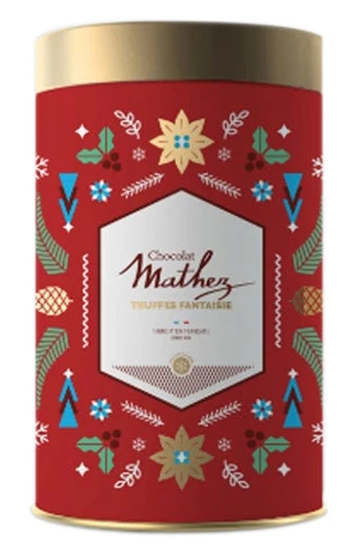 A red Christmas-themed tin containing 500 grams of cocoa-powdered chocolate truffles from Mathez. The tin is covered in abstract drawings of holly and pine trees.