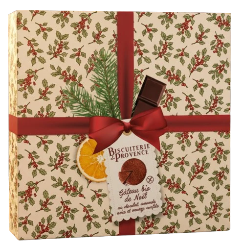 A 225 gram "holiday" box of Biscuiterie de Provence's gluten free almond cake with chocolate, walnut, and candied orange. The box features holly branches in old-fashioned design and a red ribbon.