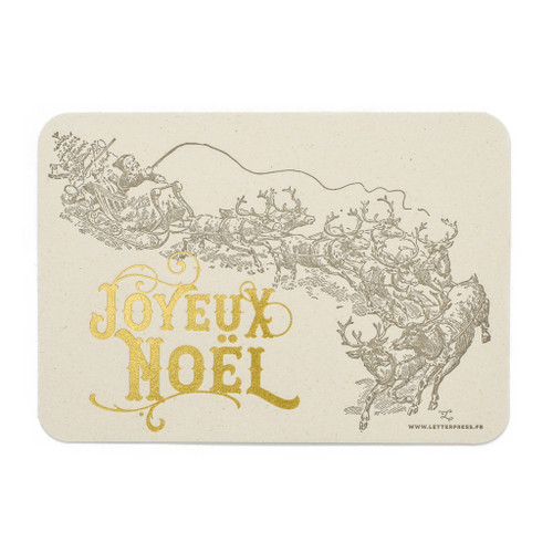 A greeting card that reads "Joyeux Noël" in gold. Above it is an ornate sketch of Santa's sleigh and his reindeer.
