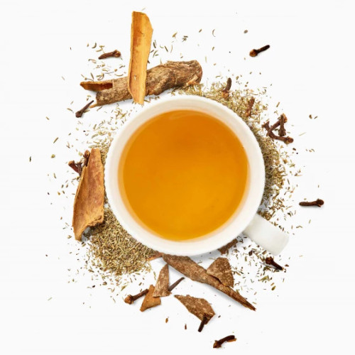 A top down image of a mug of Les 2 Marmottes "frissons d'hiver" herbal tea surrounded by a field of herbs.