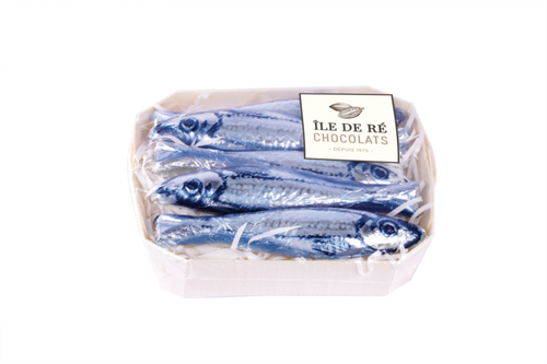 A 75 gram box of milk chocolate from Île de Ré. The chocolates inside are shaped like sardines and wrapped in tinfoil painted to mimic the actual fish.