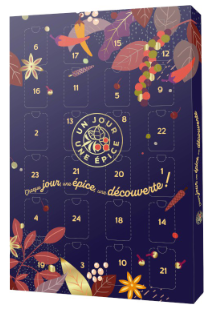 An Advent calendar from Comptoir & Co containing 24 varieties of spices in glass jars. The purple calendar has orange illustrations of various spices across the front.