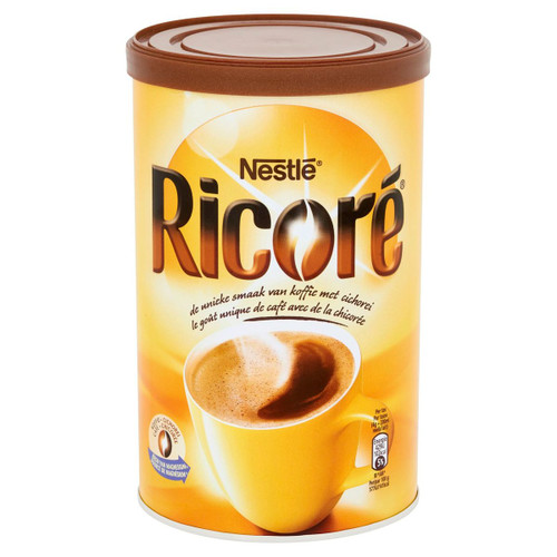 A 250 gram tin containing Ricoré chicory and coffee mix from Nestlé.