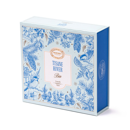 A magnetic-clasp case containing 20 sachets of Provence d'Antan organic hiver tea, a blend of cinnamon, hawthorn, and thyme. The case is a light blue and the border features sketches of pine trees, cinnamon, and birds.
