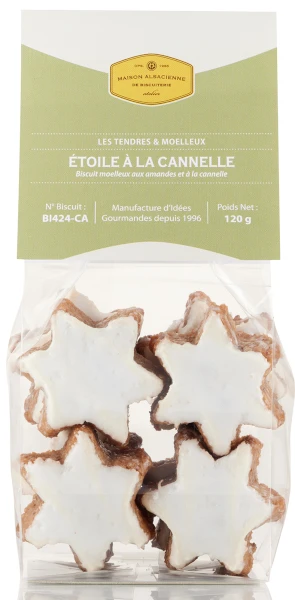 A clear bag holding 120 grams of cinnamon star-shaped cookies from Maison Alsacienne. The cookies are covered with a solid white icing spread.