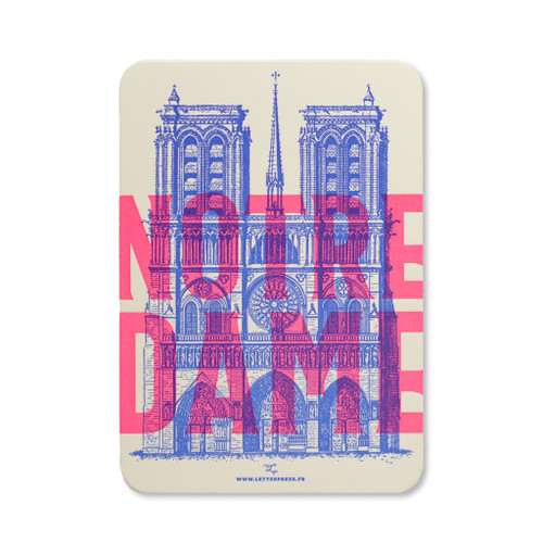 A card that reads "Notre-Dame" in fluo (neon) pink font from L'Atelier Letterpress. In the background, there is a realistic drawing of Notre Dame itself.