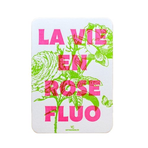 A card from L'Atelier Letterpress that reads, "La vie en rose fluo" in pink lettering in front of an illustration of a green rose.