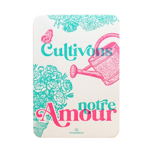 A card from L'Atelier Letterpress that reads, "Cultivons notre amour" in pink and cyan lettering in front of an illustration of a pink watering can and cyan bushes.