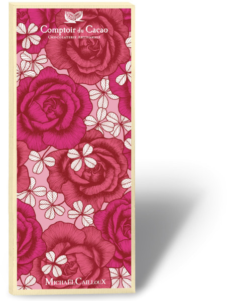A box containing an 80 gram bar of dark chocolate from Comptoir du Cacao. The front of the "Love Season" box features a patterned rose illustration by Michaël Cailloux.