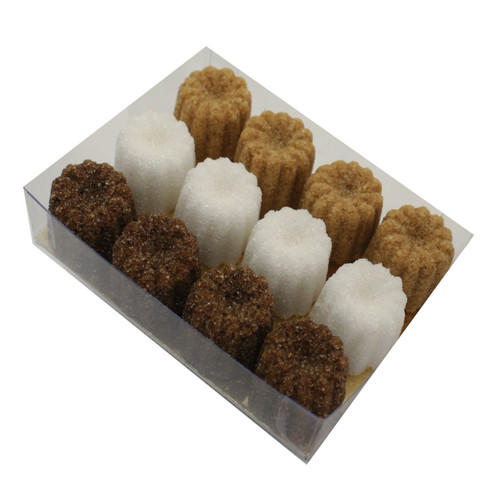 A clear box containing 54 grams of Ercus cannelé-shaped sugar pieces in brown, white, and amber.