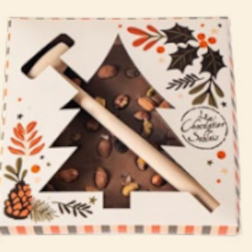 A box containing a wooden mallet and 300 gram "mendient slab" of Le Chocolatier Sablais dark chocolate. The chocolate slab contains nuts and dried fruit and is intended to be hit with the included hammer.