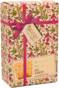 Biscuiterie de Provence sablés cookies with pink pralines in a 80 gram gift box. The box is printed with a sepia-tinged illustration of vines and an image of a pink ribbon.