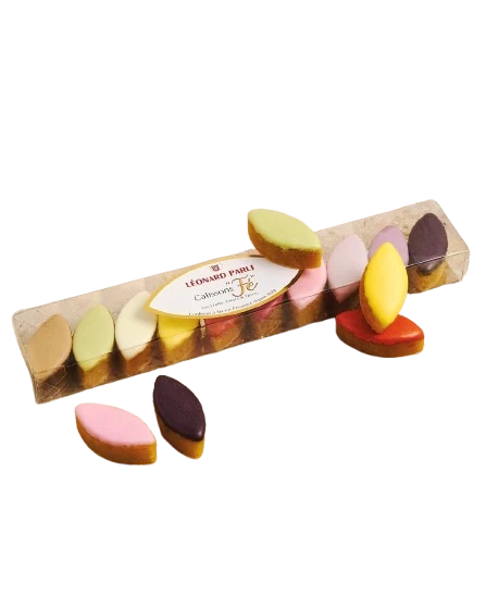A clear box showcasing 65 grams of mini flavored calissons from Léonard Parli. They are in a single row and are assorted pastel colors.