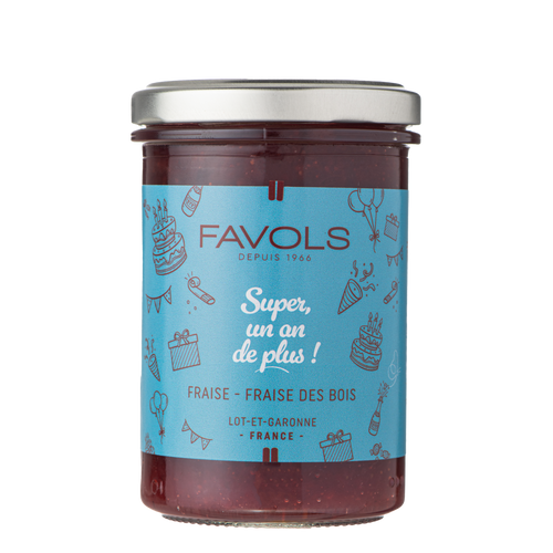 A 250 gram jar of "Un An De Plus!" strawberry and wild strawberry jam, made by Favols. The jar has a light blue label that says, "Super, un an de plus!"
