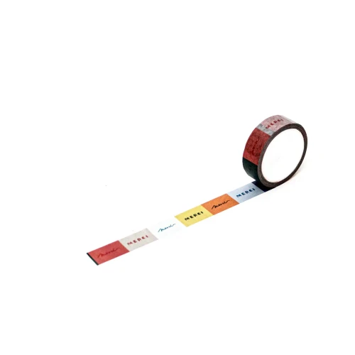 A multicolor masking tape that reads "Merci"