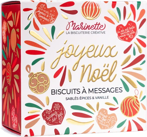 A 100g square box of Marinette heart-shaped shortbread cookies in red and green hues, bearing the message "Joyeux Noël".