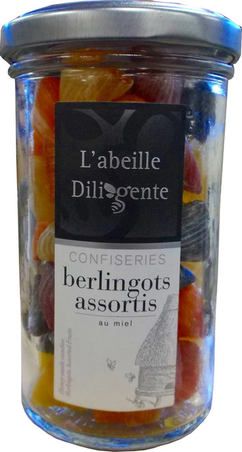 A 170 gram jar of berlingot honey candy from L'Abeille Diligente. The candies are a variety of colors and feature faint white striping.
