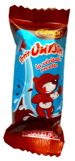 A 11 gram piece of Cémoi's bear shaped "petit ourson" candy, made of marshmallow and milk chocolate.
