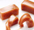 Squares of caramel beginning to melt and soften.