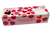 A 90 gram box of heart-shaped almond macarons with raspberry pieces from Biscuiterie de Provence.