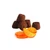 Several of Mathez's cocoa-powdered truffles with candied orange next to candied orange slices.