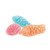 A trio of Kubli candy pieces in various shapes: a red shell, a blue fish, and an orange fish.