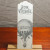 A "Bon Voyage" bookmark featuring a sketch of a hot-air balloon that reads, "Le Pilote." The bookmark is displayed on a table stand.