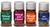 A collection of glass jars from Comptoir & Co's spice Advent calendar. The tiny jars read, "Mélange Zaatar," "Mélange Pain d'Épices," "Mélange Poulet Rôti," and "Sel Fumé."
