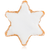A close-up view of a cinnamon star cookie from Maison Alsacienne. The cookie is shaped like a 6-point star and is covered in a layer of white icing.