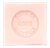 A 100 gram light peach colored cube of Senteurs de France's rose-scented Marseille cube. The cube is embossed with the words, "Savon de rose Marseille."