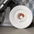 A white dessert plate with a croissant illustration.
