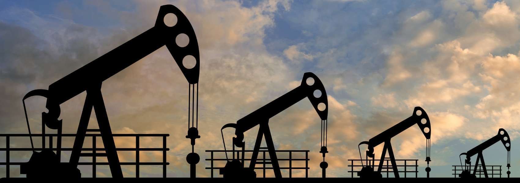 4 oil rigs in an oilfield