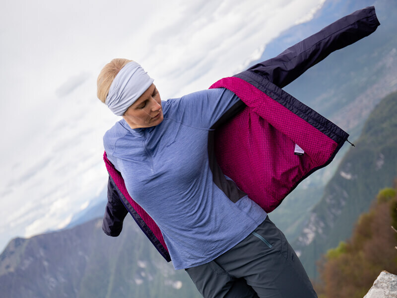 Bora Jacket on Woman with Arms Out Showing Octa Fleece Inner Layer