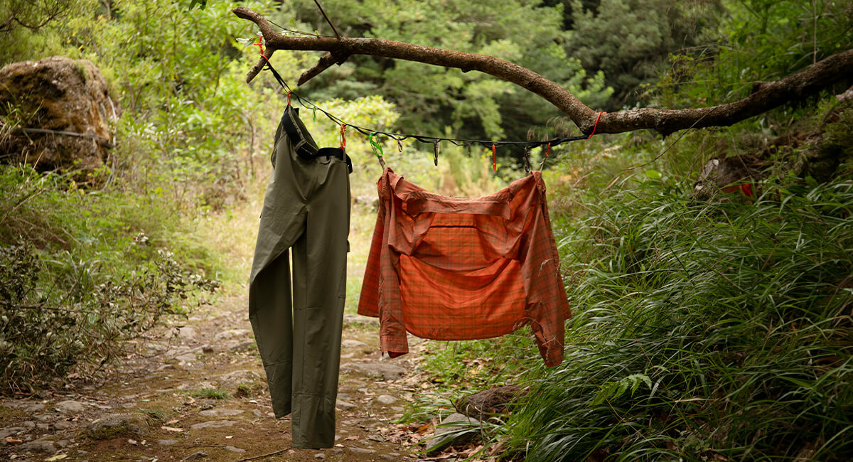 Savannah Shirt and Trousers hanging up off tree branch to dry
