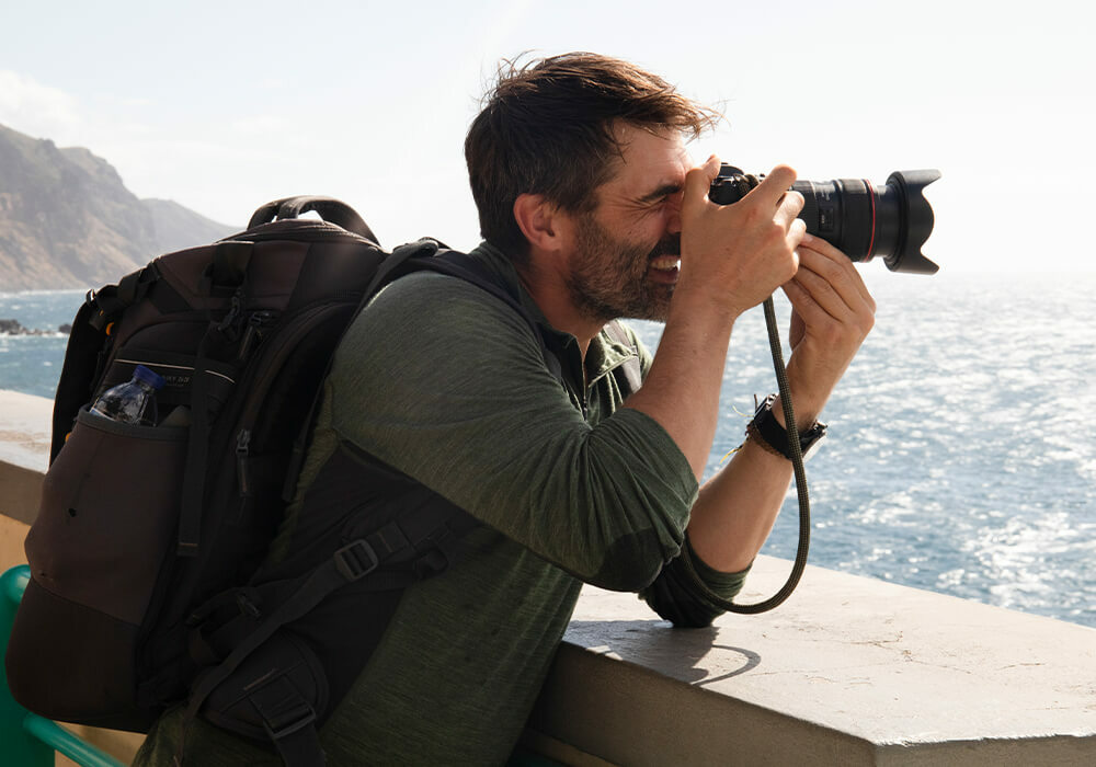 Ian Finch Photographer Taking Photo in Madeira Coastline