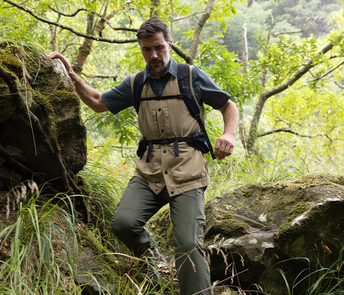 Man in Wooded Area Wearing Insect Repellent Clothing