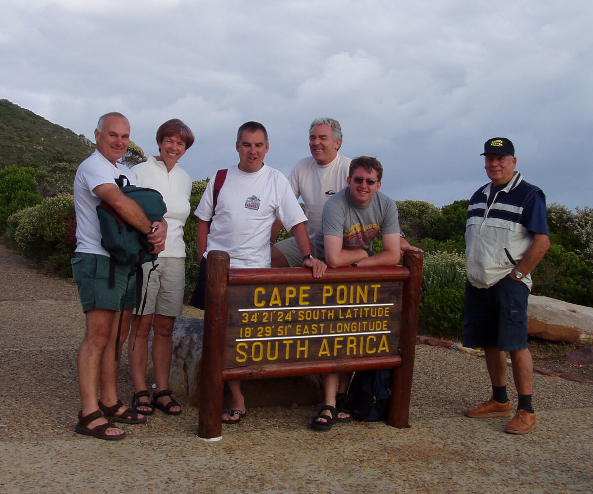 Liz and her family stood by signage at Cape Point, South Africa.