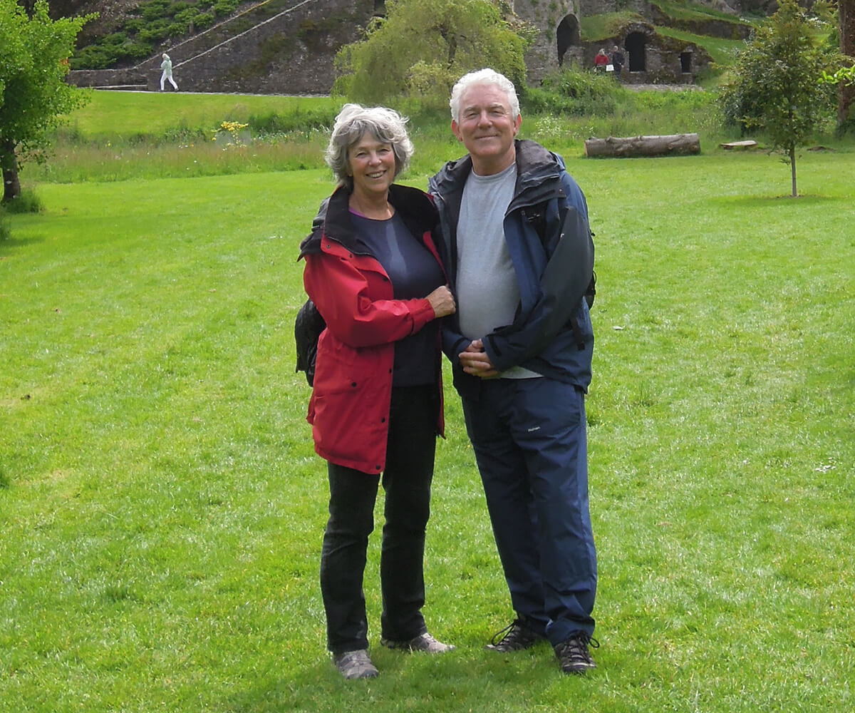 Liz and husband stood in front of Blarney Castle.