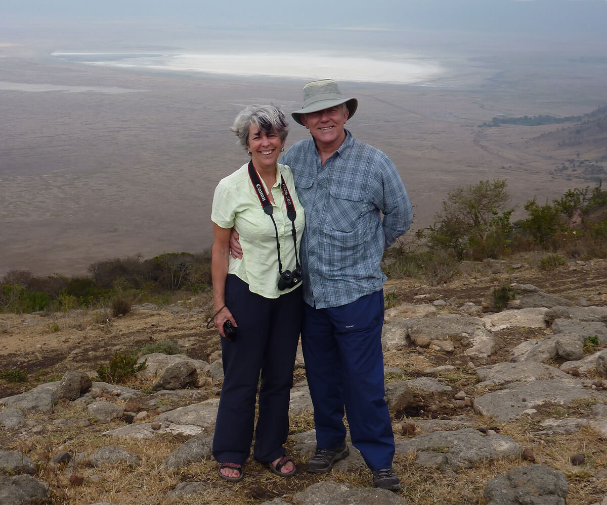 Liz and husband standing in front of Ngorongoro Crater