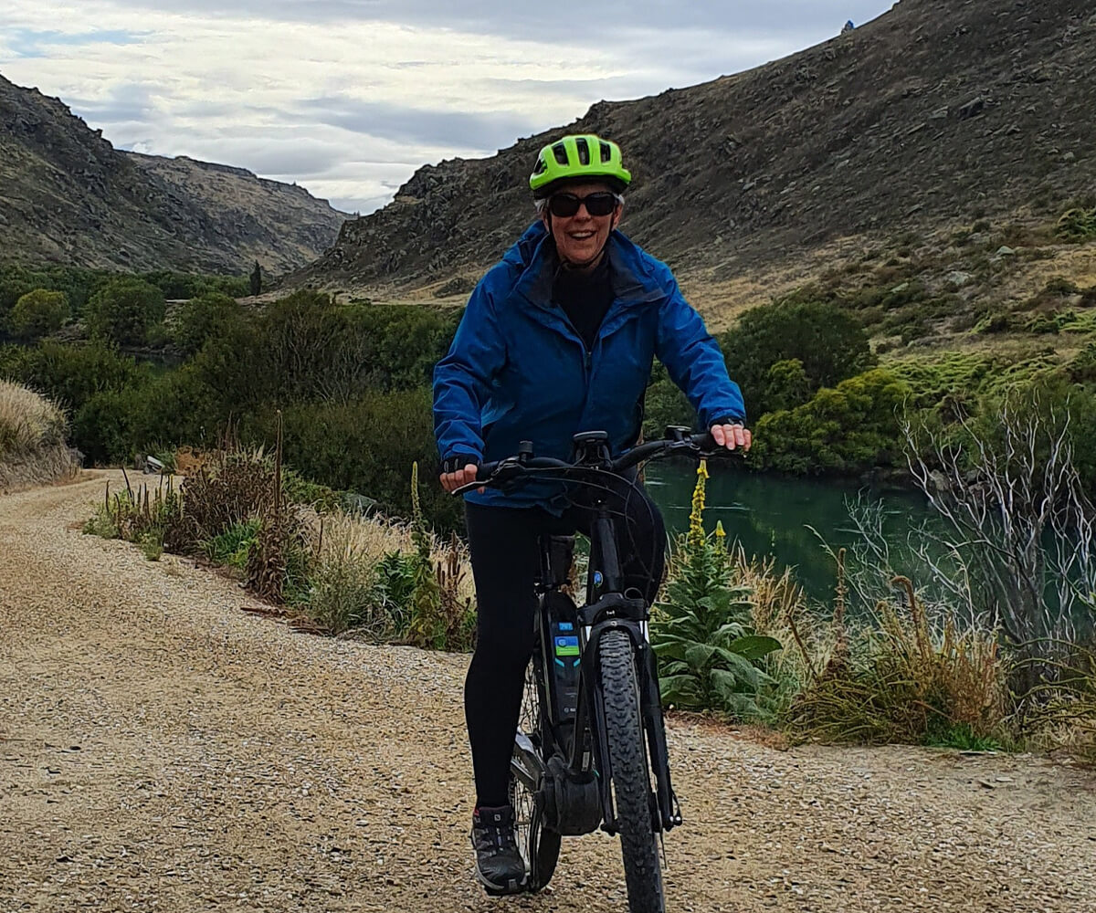 Liz cycling in New Zealand.