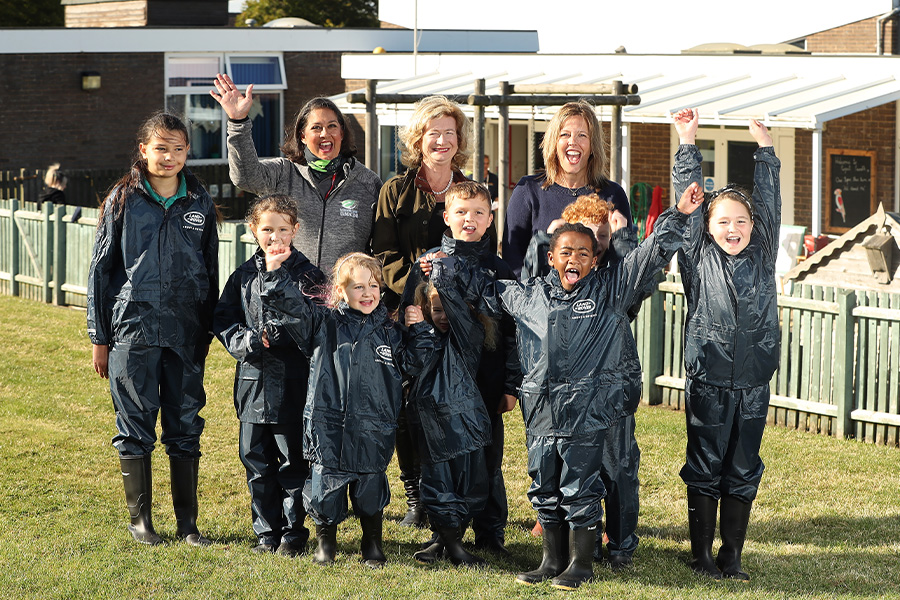 The Outdoor Guide foundation group of children and leaders in waterproof clothing and wellies