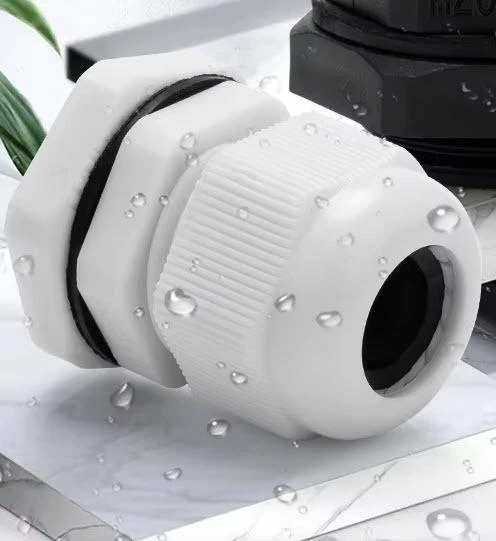 J.Racenstein Cable Gland 1/8in to 1/4in wire, waterproof cable gland for electrical wiring, white industrial cable connector with water droplets.