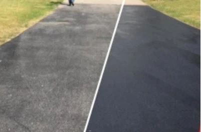 Deco Products Inc. Bio BlackTop Asphalt Sealer, side-by-side comparison of an asphalt driveway before and after sealing with BlackTop asphalt sealer.